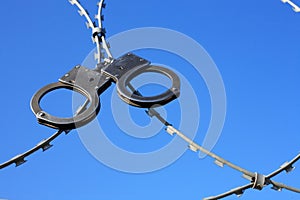 Old Handcuffs On Razor Wire