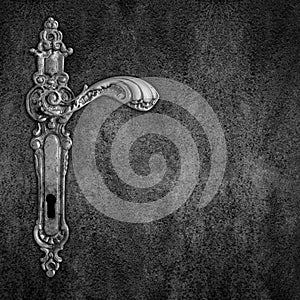 Old handle on black plate background