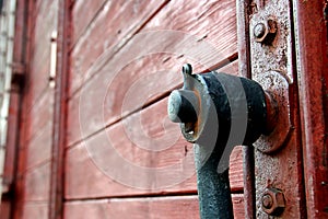 The old handle of a wooden door.