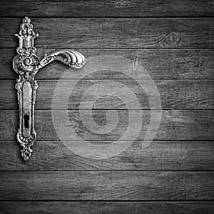Old handle in wooden door
