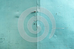 Old handle on worn metallic gate