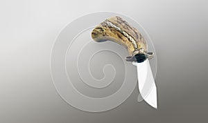 Old handmade hunting knife with deer horn handle