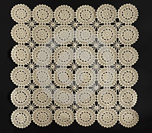 Old handmade Lace pattern background on a black background