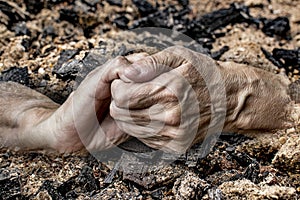 An old hands on a ash background