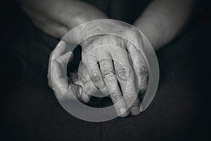 Old hands of elderly man