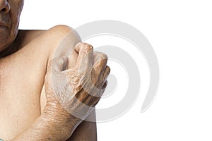 Old hands itching in arm on white background