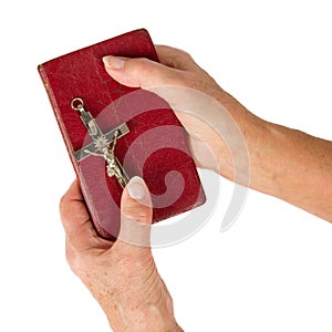 Old hands (woman) holding a very old bible