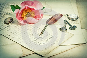 Old handwritings, antique feather pen, keys, pocket watch and pi