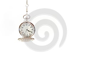 Old, hanging pocket watch isolated on white background.