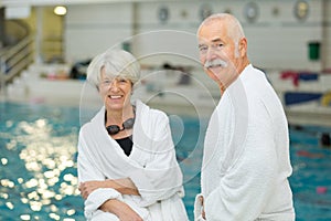 old happy couple in swimming pool photo