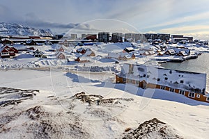 Old harbor and Nuuk city center covered in snow, Greenland