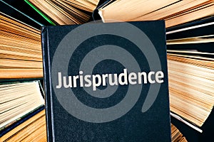 Old hardback books with book Jurisprudence on top photo