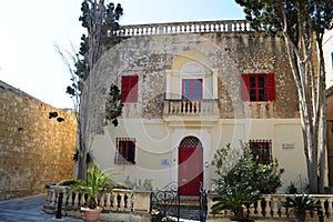 Old hause in Mdina, Malta. hause has red widows and authentic view