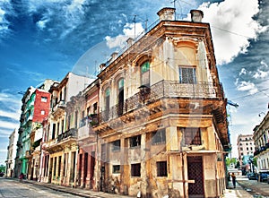 Old Havana colonial building with balconies against blue sky
