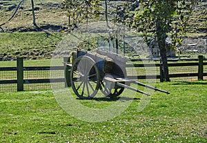 Old hay cart at a farm in a sunny day