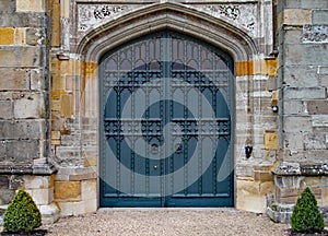 Old heavy ornate door in an old English manor house