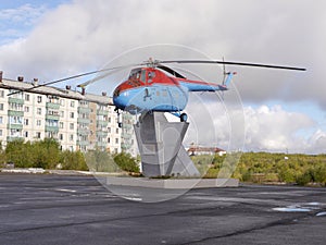 Old helicopter on pedestal