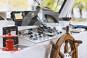 The old helm on a modern ship. The ship\'s wheel, and all control dash board