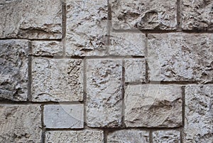 Old hewn stone wall, beautiful background texture