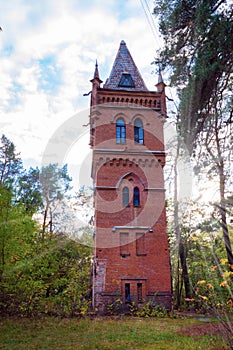 Old high brick water tower in the Gothic style in the estate Natalyevka, Kharkiv region, Ukraine