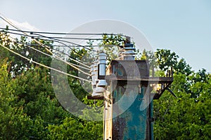 Old high voltage transformer with insulators and wires