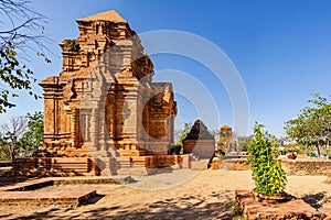 Old historic brick temple tower of Po Sha Inu Sham in Phan Thiet, Vietnam on a sunny day