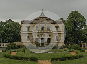 Old historic building in rainy park in Plzen city in west Bohemia