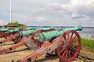 Old historic canons on Kronborg castle pointing to the ocean