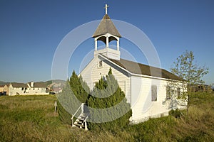 Old historic church near Somis, Ventura County, CA with view of encroaching new home construction