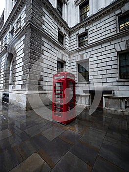 Old historic classic traditional typical public red telephone box kiosk booth in London England Great Britain UK