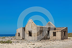 Old historic house as ruin on beach