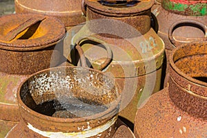 Old historic rusty milk canisters in Orvelte