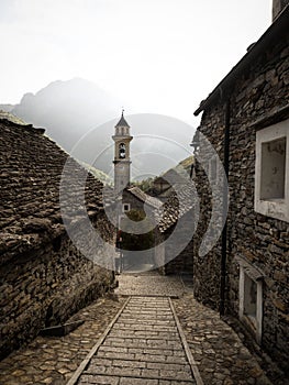 Old historic traditional schist stone rock building church tower in Sonogno village Verzasca Valley Ticino Switzerland