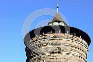 Old historical brick blocks tower with clear blue sky in winter