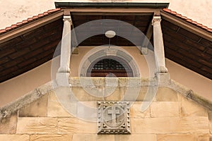 Old historical building with an anchor made of stone