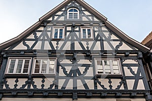 Old historical building and half-timber house with blue or gray wood