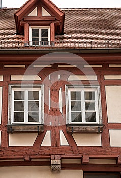 Old historical building and half-timber house with red wood