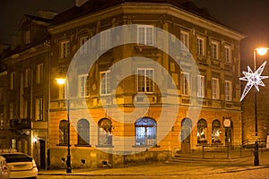 Old historical building on the Mostowa street in Warsaw at winter night.