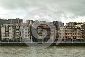 Old And Historical Buildings Of 1900 Beginnings Viewed From Portugalete To Sunrise. Architecture History Travel. photo
