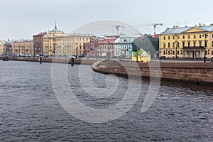 Old historical buildings on the Lieutenant Schmidt Embankment of Saint Petersburg formerly named Leningrad.