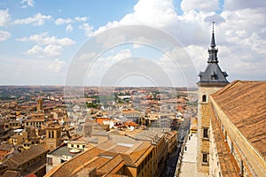 The old historical city of Toledo under blue sky with cumulus clouds.