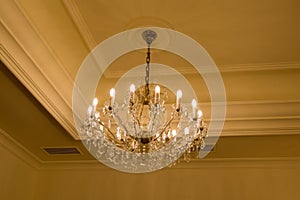 old historical crystal ceiling light in a palace