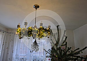 old historical eight-armed chandelier. silver single with spruce cone shaped