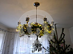 old historical eight-armed chandelier. silver single with spruce cone shaped