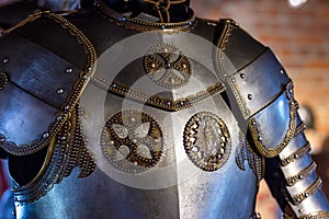 Old historical medieval iron knight armor for ancient warriors protection in combat. Traditional past fighter heavy metal defense