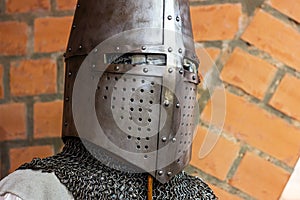 Old historical medieval iron knight helmet armor for ancient warriors protection in combat. Traditional past fighter