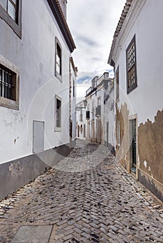 Old, historical street of Faro city in Portugal