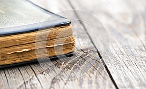 Old holy bible, pray book on wooden background
