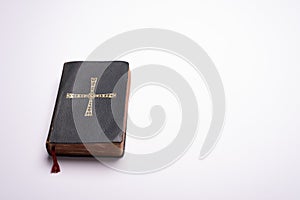 Old Holy Bible on white background desk with copy space photo