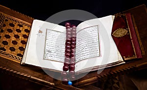 Old Holy Islamic book Koran opened in leather binding with brown